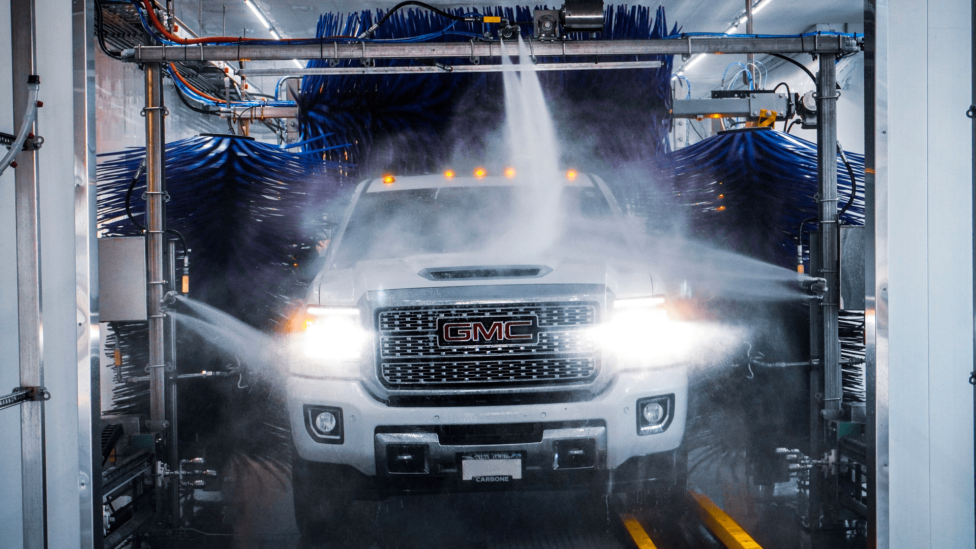 Truck going through car wash tunnel