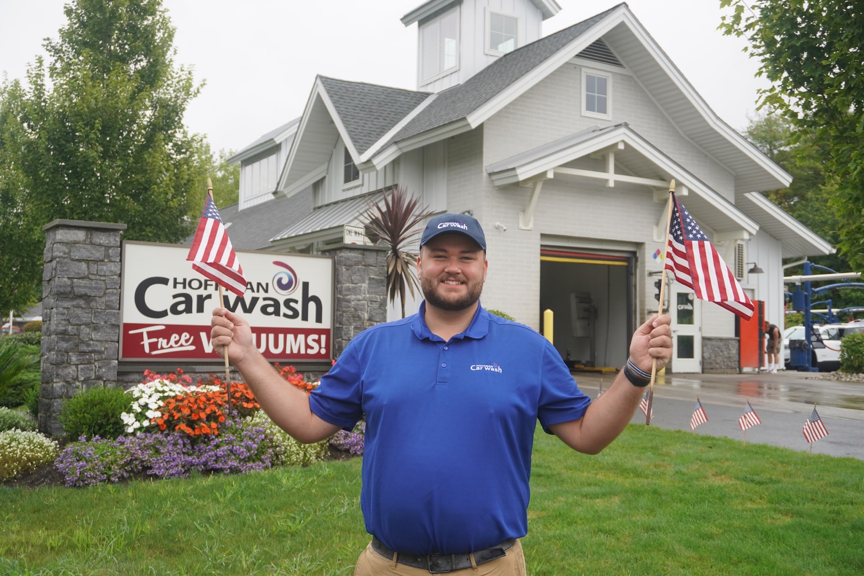 A man holding American flags in his hands